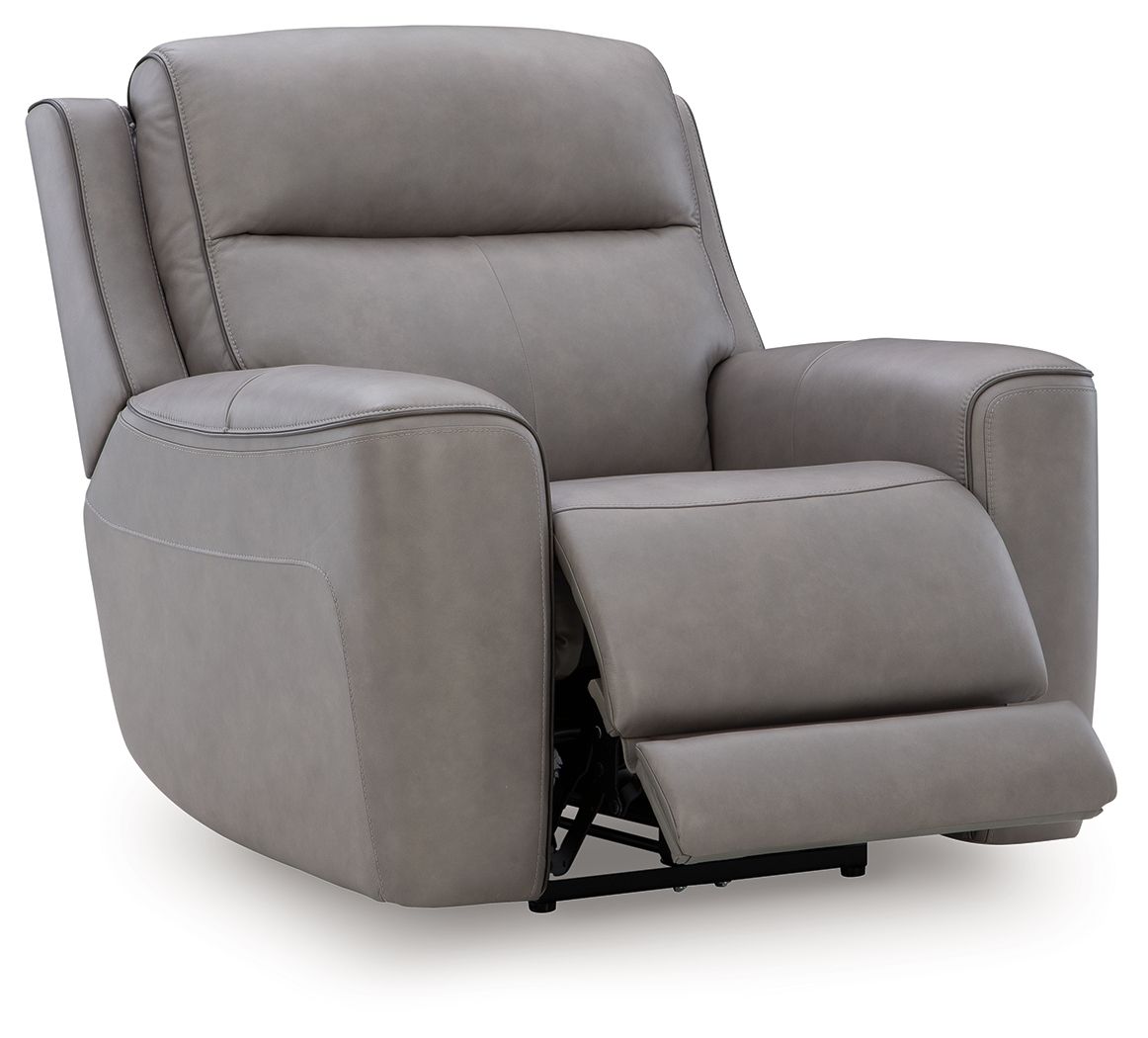 Gray power recliner with adjustable headrest, extended footrest.