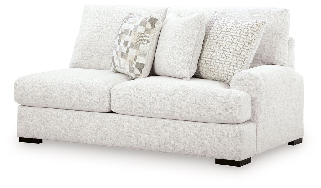 Chalk loveseat with three pillows and dark square feet