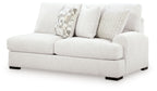 Chalk loveseat with three pillows and dark square feet