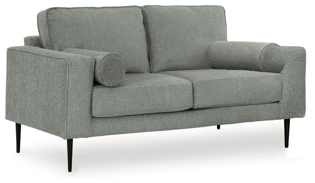 Charcoal loveseat with rolled arms, deep seat, and two round accent pillows