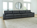 Long sectional sofa with tufted back cushions and dark upholstered seats