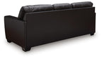 Glennbre queen sofa sleeper, dark midnight, side view with padded arm and back.