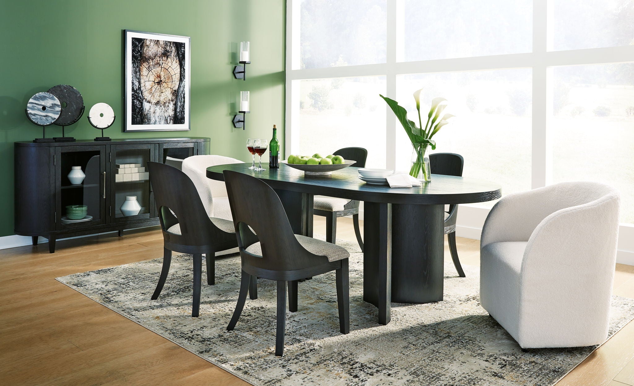 Black dining table with black chairs and side server cabinet