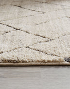 Textured light gray rug with short cut pile and border trim