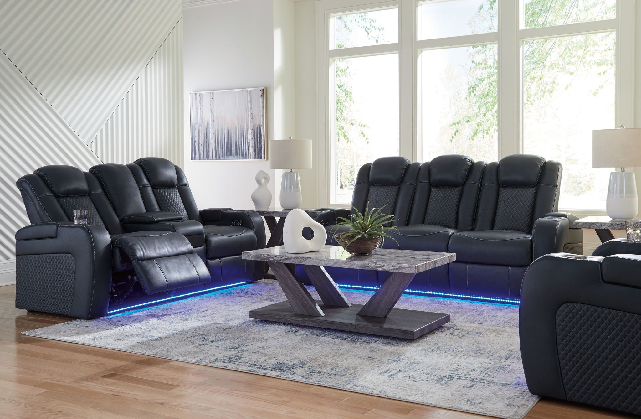 Dark gray reclining living room set recliner sofa and chairs with blue-lit base and padded arms