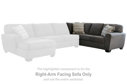 Right-arm facing dark gray sectional sofa with chaise and patterned pillows