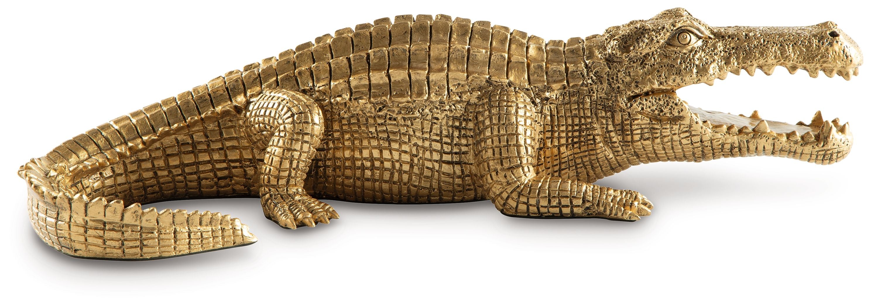 Antique gold crocodile sculpture in profile, ribbed scales and curled tail