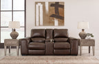 Brown leather loveseat with reclining seats, center console, and padded armrests.