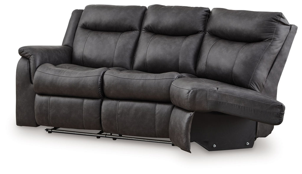 Dark gray reclining loveseat with high back cushions, padded track arms, and footrest