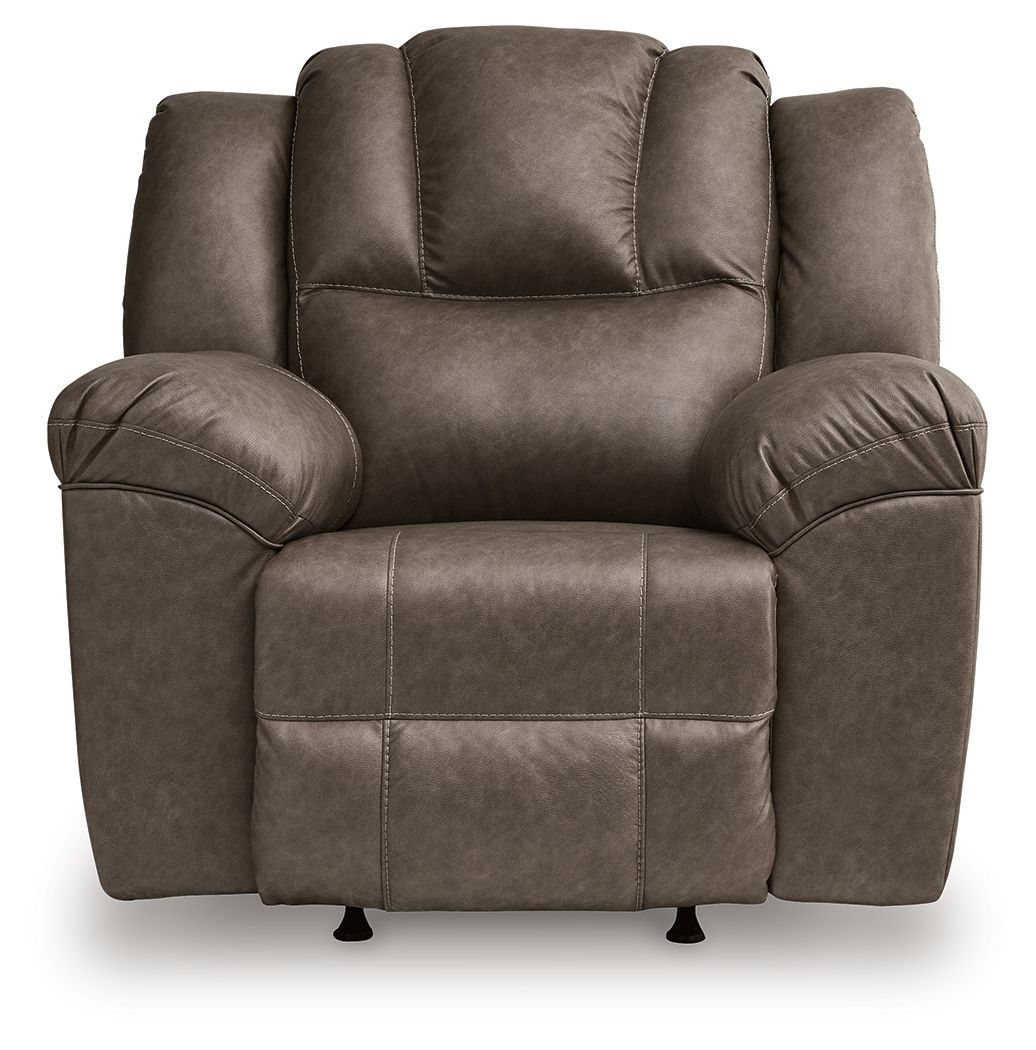 Dark brown rocker recliner chair with button-tufted back, wide armrests, and base