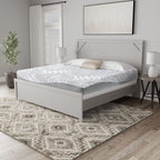 White hybrid mattress with wavy quilted top and gray sides on a bed frame