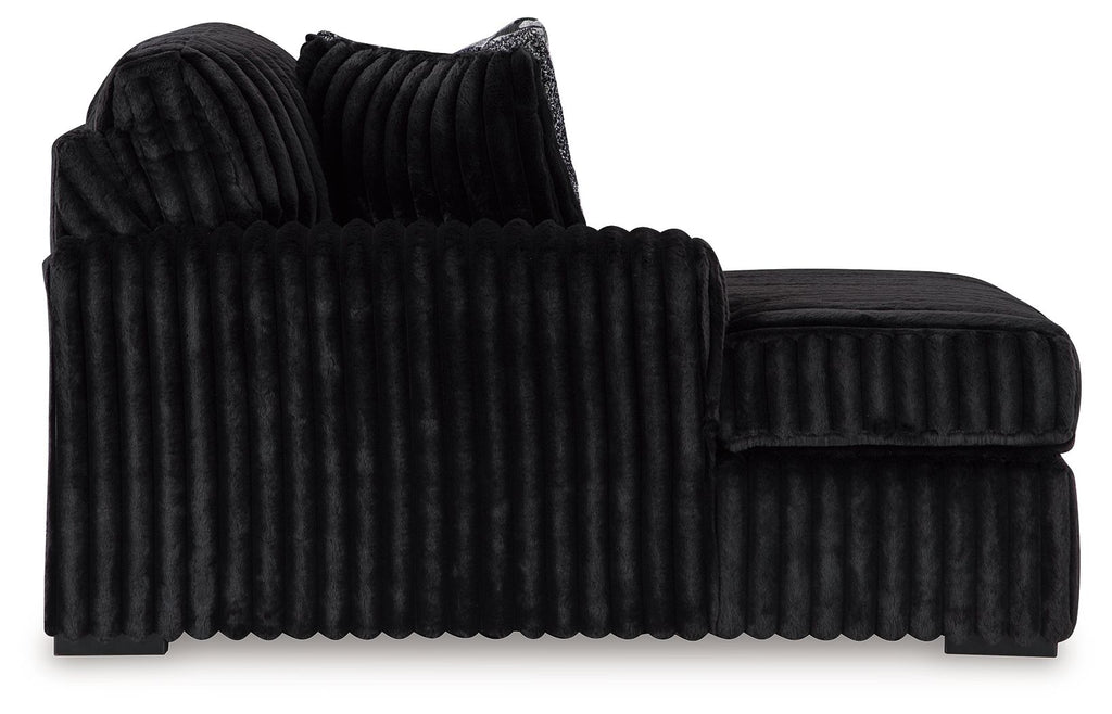 Onyx corded corner chaise with tufted ribbed upholstery and rolled arms