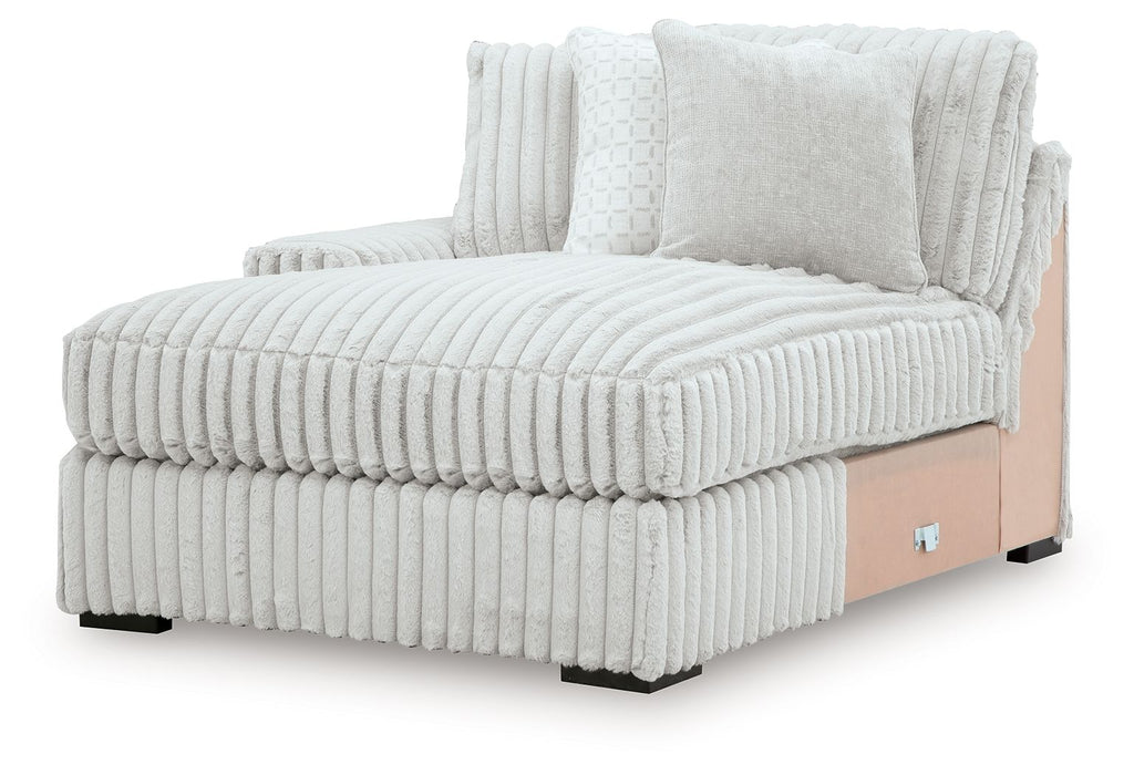 White corner chaise with ribbed upholstery, two back cushions, and wood-toned side panel
