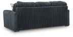 Dark gray corduroy sofa with track arms and a wide three-seat backrest, side view.