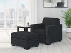 Black textured accent chair paired with matching ottoman