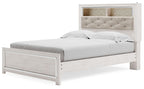 Queen panel bed with white wood rails and padded tufted headboard