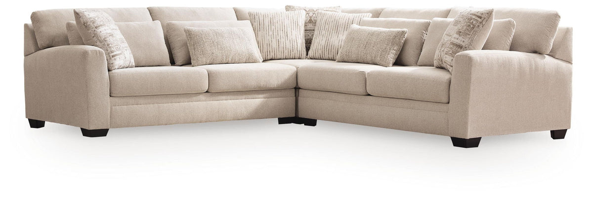 Light beige sectional sofa with chaise corner, tight back cushions and tufted seats