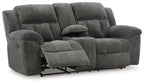 Dark gray double reclining loveseat with extended footrests and tufted seat cushions