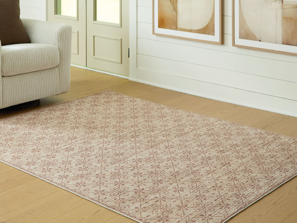 Area rug corner view with repeating red lattice pattern on beige ground