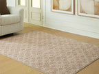 Area rug corner view with repeating red lattice pattern on beige ground