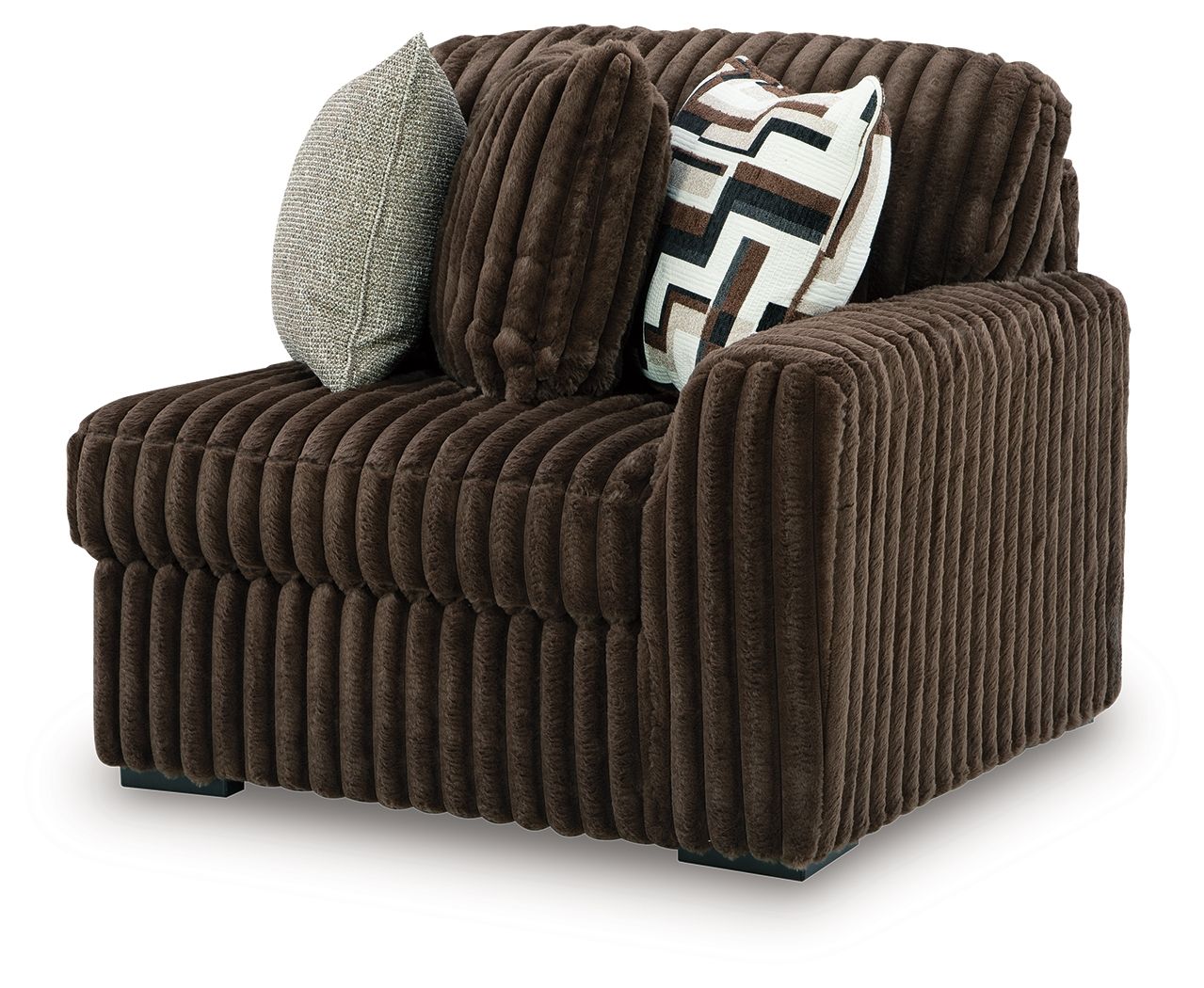Chocolate corduroy right-arm corner chair with two throw pillows on the arms