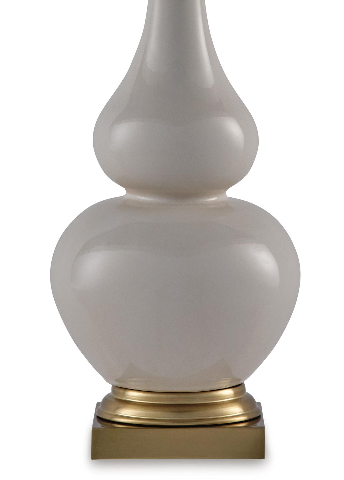 Close-up ceramic table lamp base with cream shade, gold ring and pedestal
