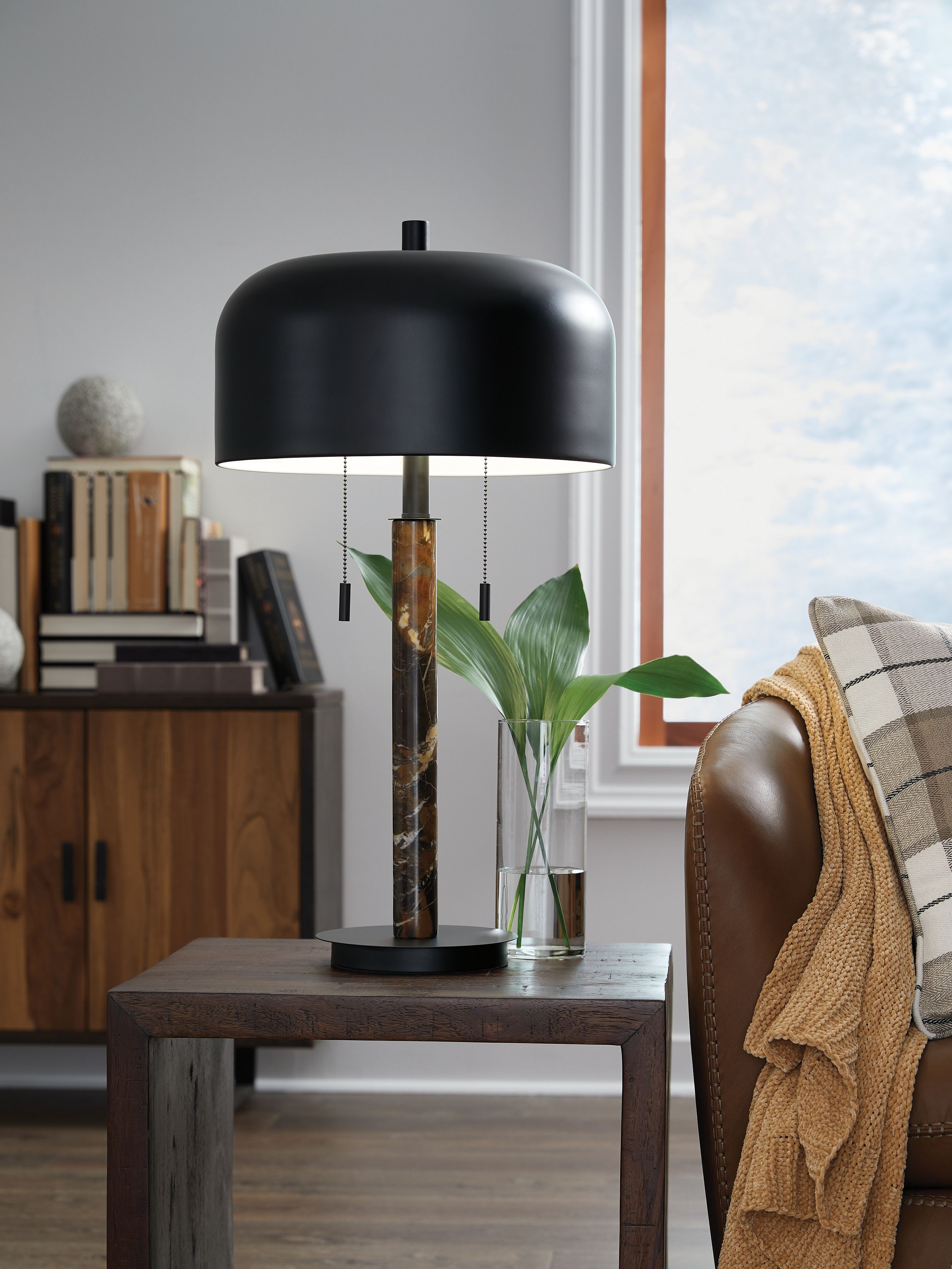 Metal table lamp with black arched shade and brown marbled column base