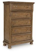 Medium brown wooden five-drawer chest with metal knobs and beveled drawer fronts