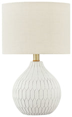 Ceramic table lamp with white fabric shade and white diamond-patterned base, brass stem