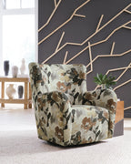 Floral upholstered swivel glider chair with thick arms and back; beige base with brown/gray