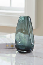 Light blue glass vase, rounded base and flared top opening