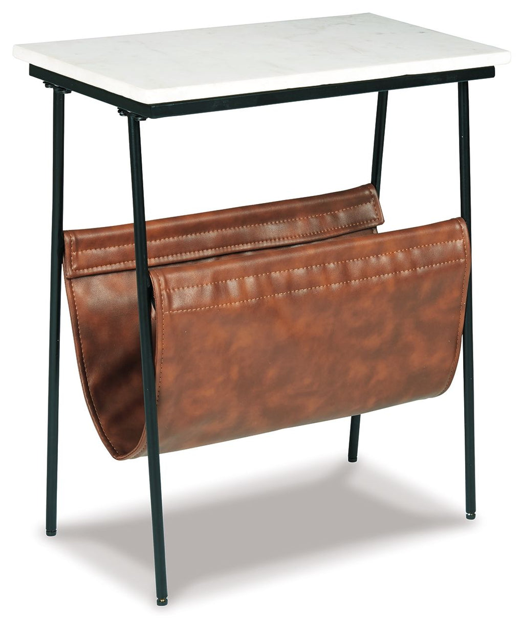 Accent table with white top, black legs, and brown leather front magazine holder