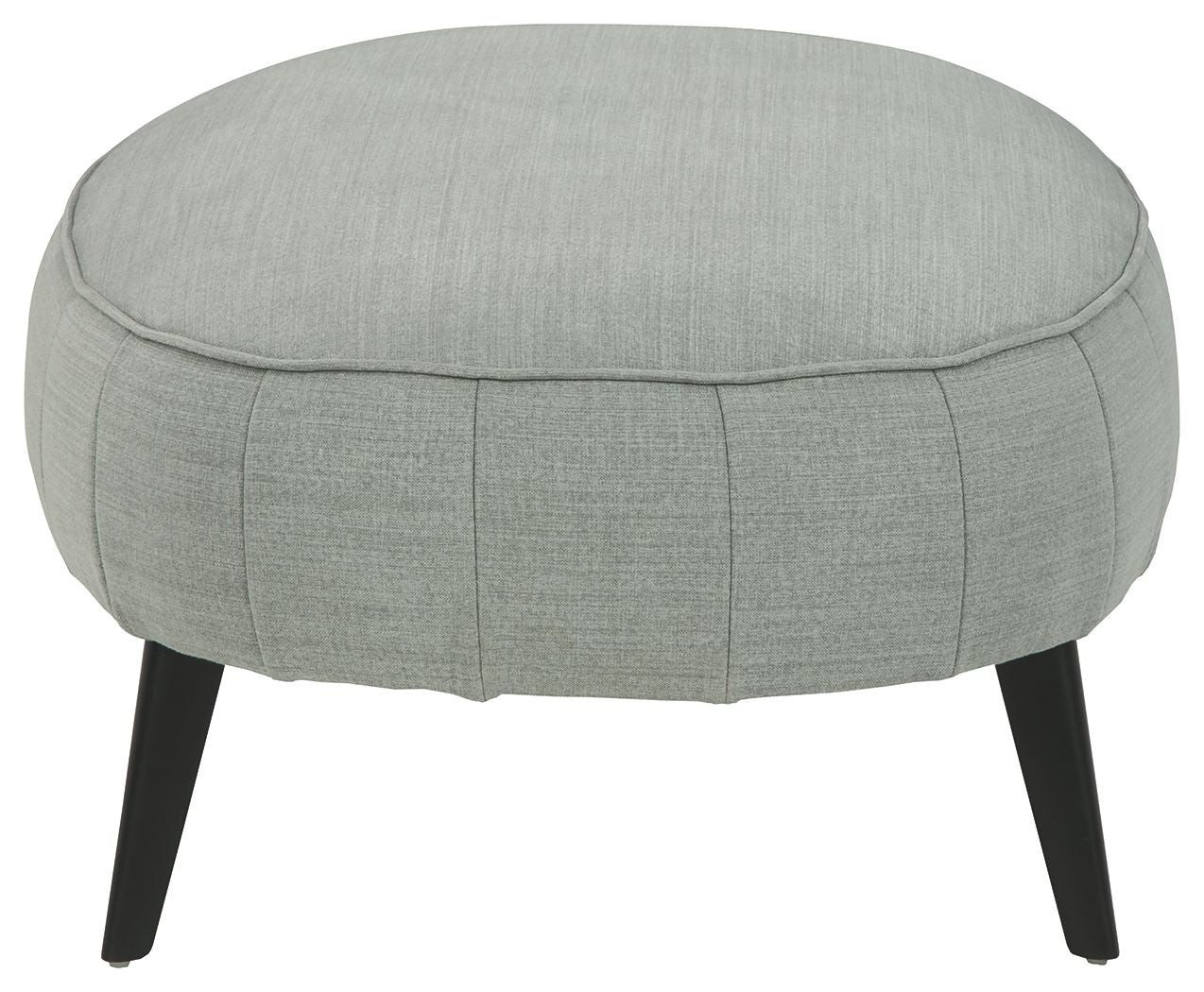 Gray round accent ottoman with low top stitching and four dark tapered legs