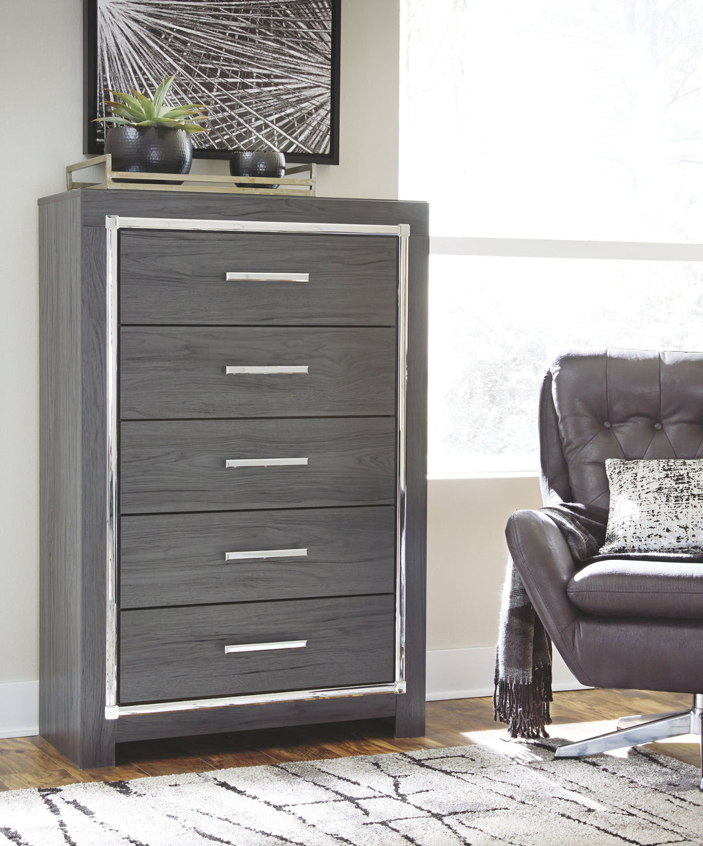 Gray five-drawer chest with metal bar pulls in front view