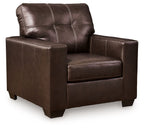 Dark brown leather accent chair with tufted back and square padded arms