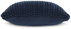 Navy knitted pillow with rounded edges and thick braided texture, side view.