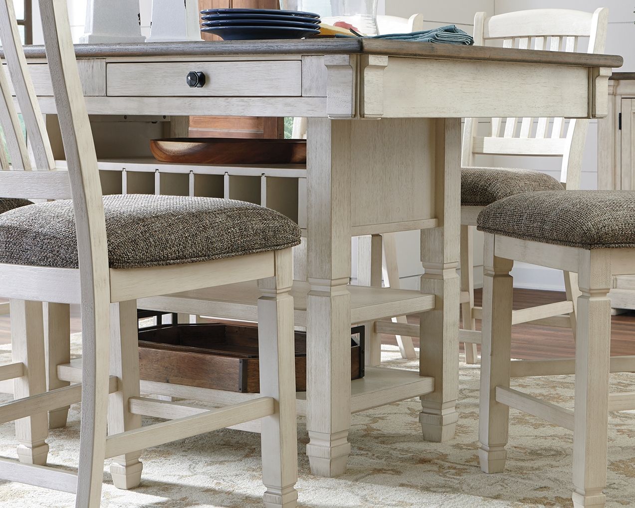 Beige rectangular dining counter table with two drawers, side legs, and open lower shelf