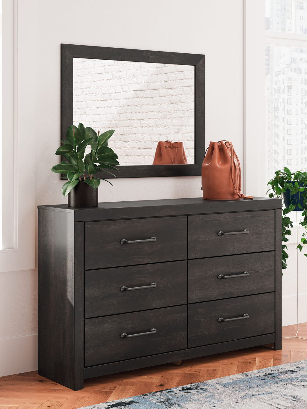 Dark gray dresser with square mirror and six drawers, metal bar pull hardware
