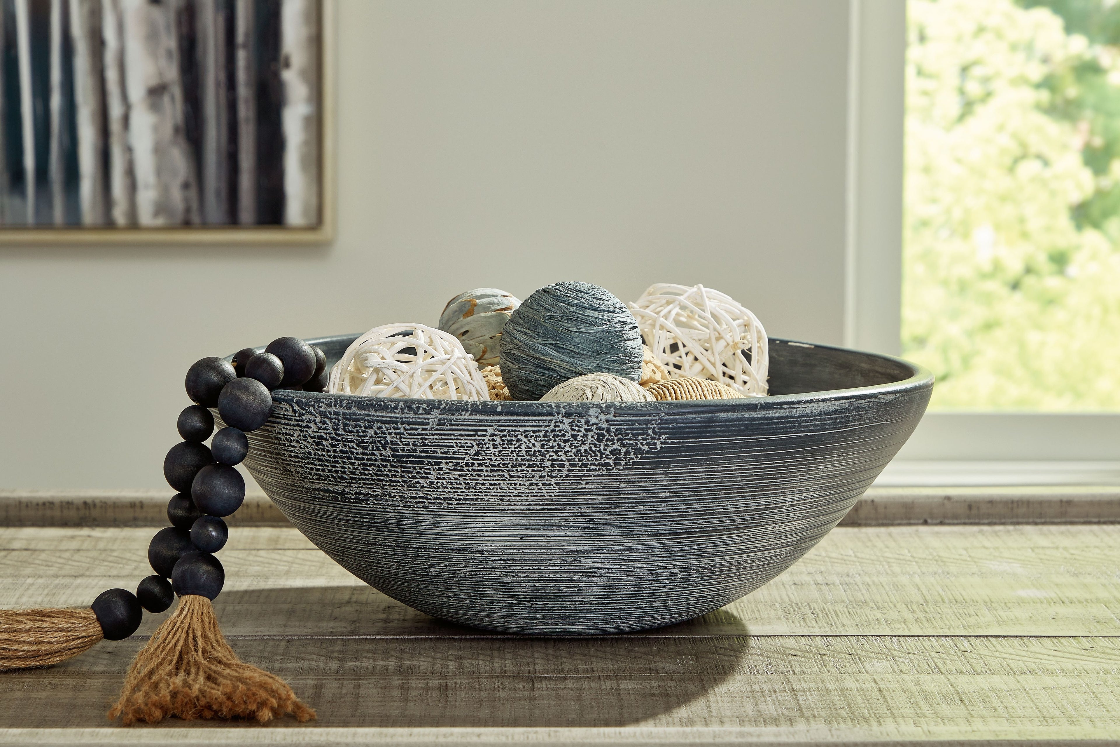 Textured ceramic bowl with wide rim and dark gray finish