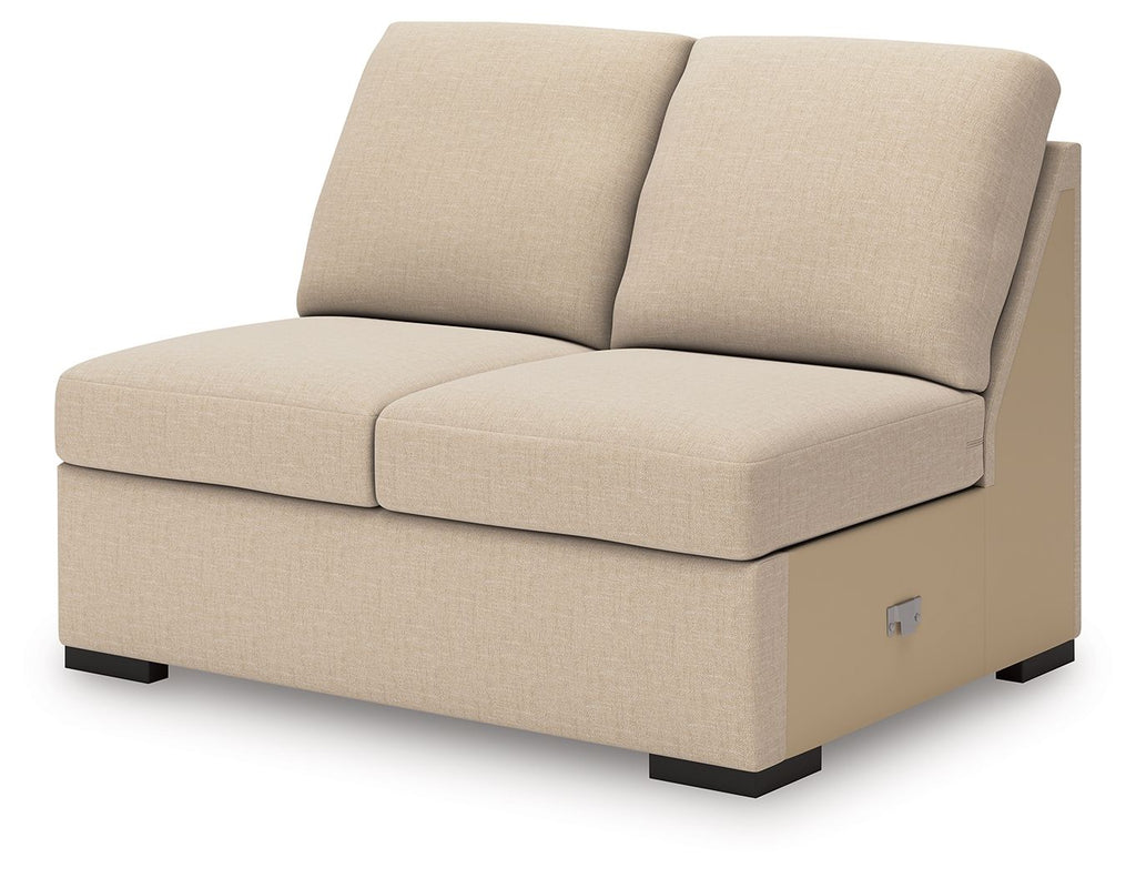 Armless loveseat in light beige twill, rounded seat, two back cushions, black feet