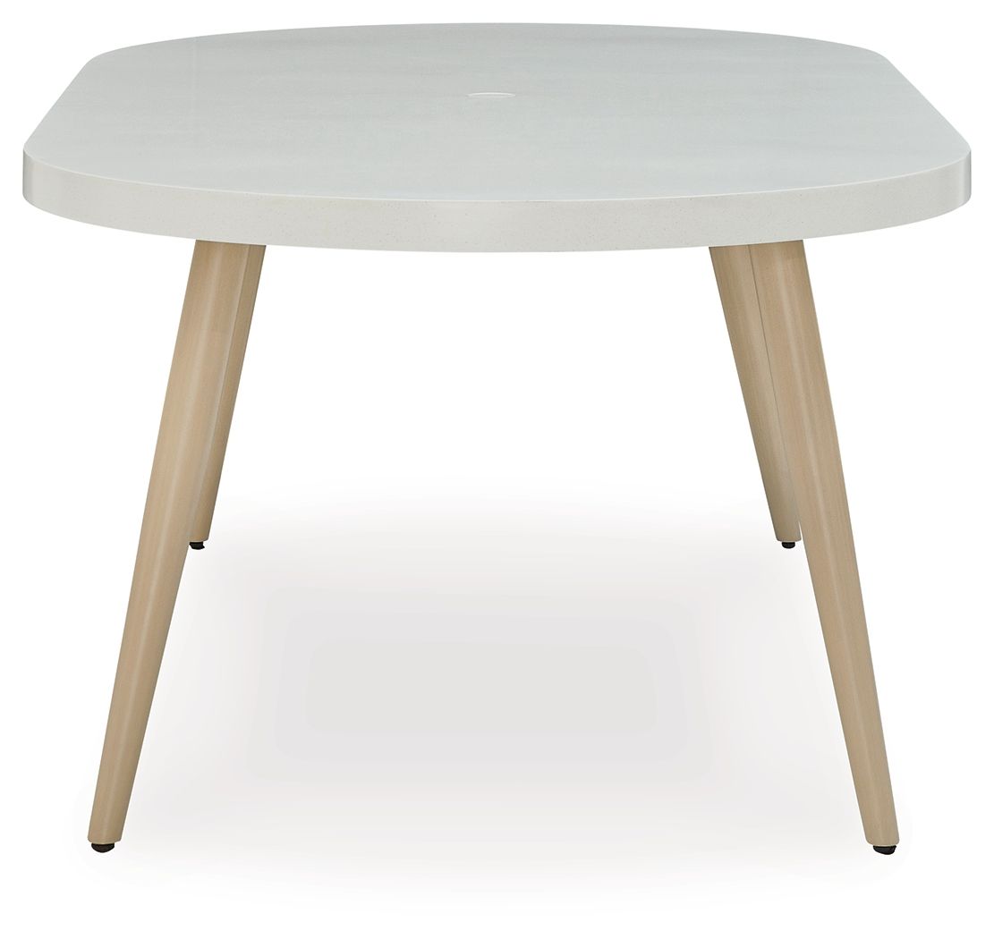 Dining table with light gray round tabletop and four light wood legs