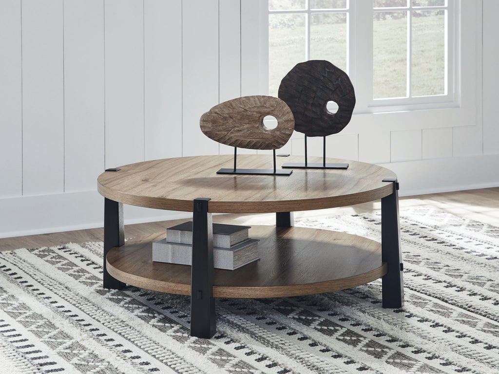 Round two-tier coffee table with light wood top, dark legs, and open lower shelf.