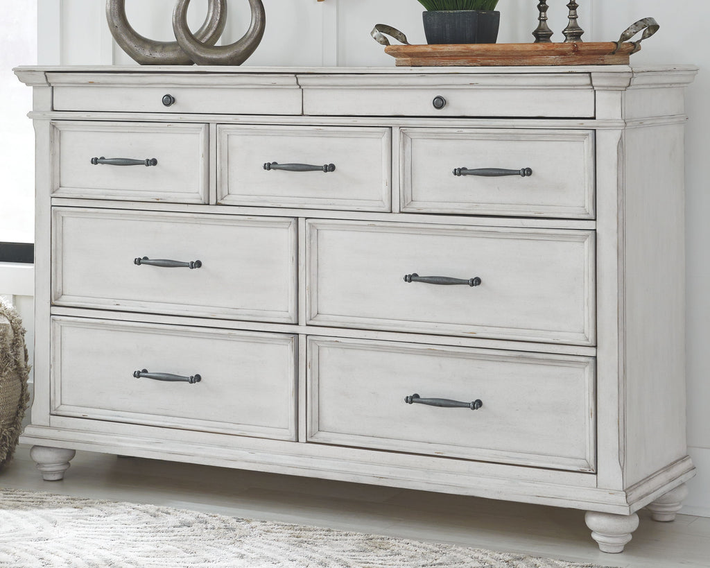 White dresser with six drawers and metal bar pulls
