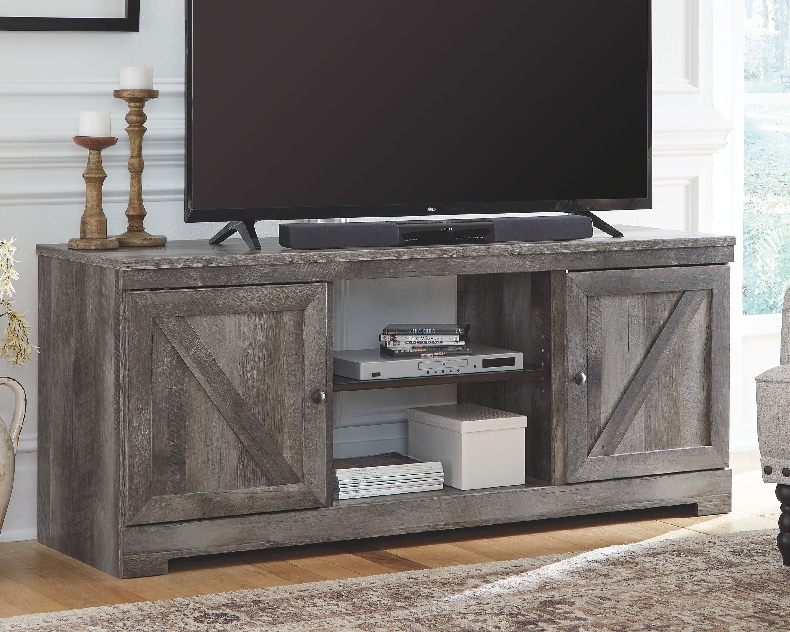 Gray TV stand with fireplace option, two cabinet doors and open media shelf