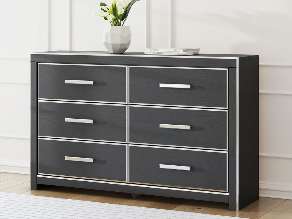 Six-drawer dresser in dark finish with six drawers and long silver bar handles.