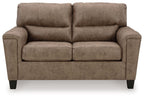 Taupe upholstered loveseat with tufted back, padded square arms, and two seat cushions