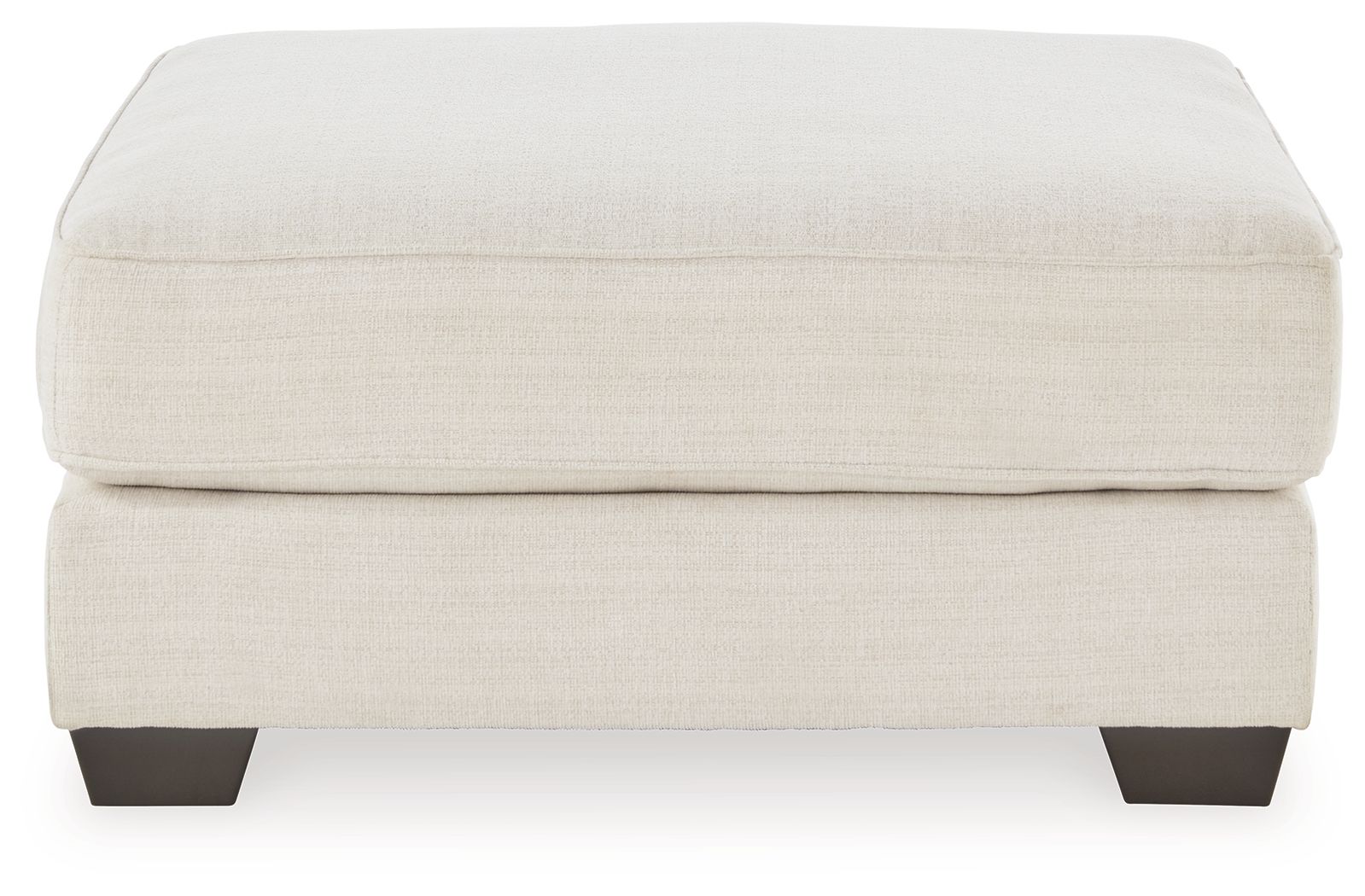 Oversized ottoman with beige fabric upholstery and dark wooden feet.