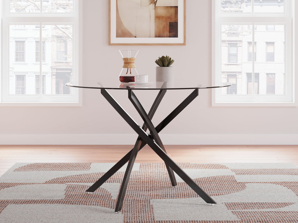 Round dining table with clear glass top and black X metal base