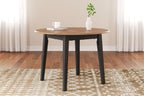 Round drop-leaf dining table with light wood top and dark legs