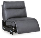 Power armless recliner with adjustable headrest, dark blue fabric, recline base shown from side angle.
